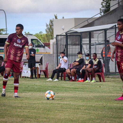 First team players j adams and a brenner stand over.jpg