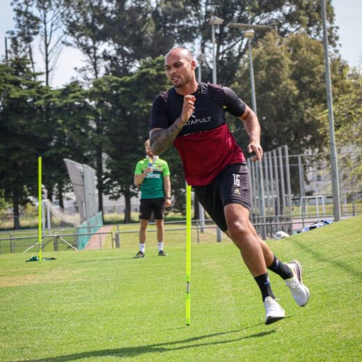 Club captain robyn johannes working on getting the boots laced.jpg